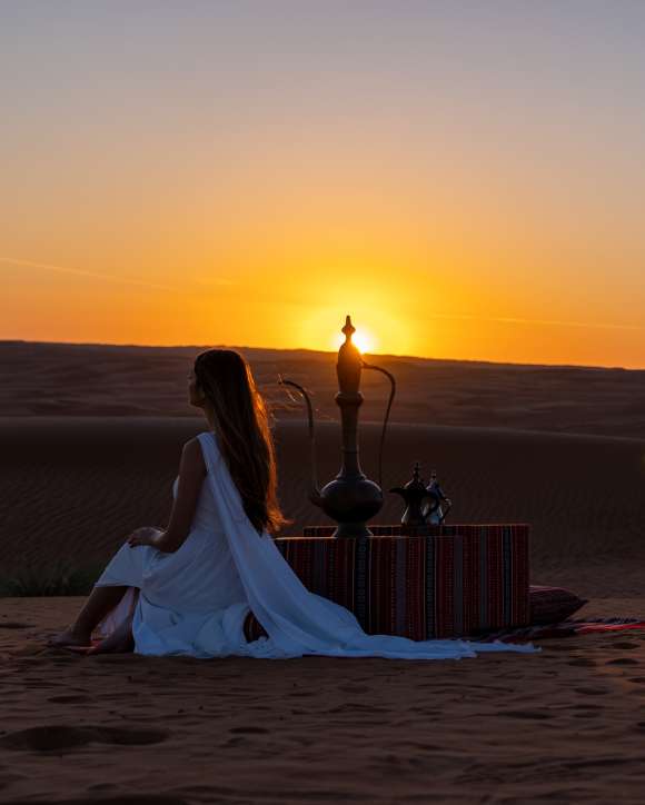 Majlis setup over the dunes during sunset